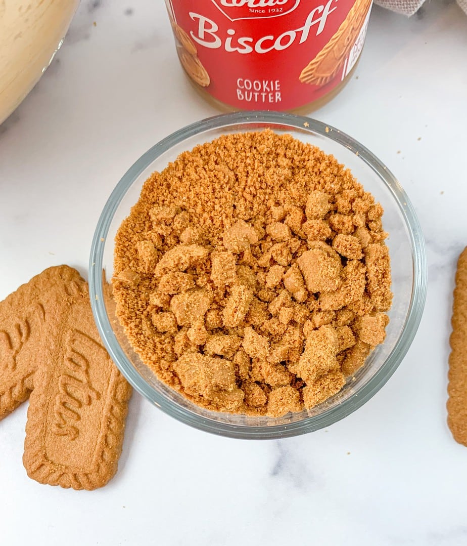 A dish of Biscoff cookie crumbs for a lotus biscoff cookie cheesecake