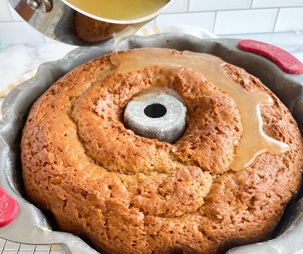 Pouring the syrup all over the bundt cake