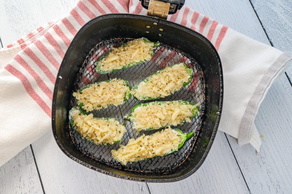 Add the poppers to the air fryer basket