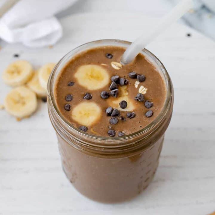 Smoothie with bananas, chocolate, and a straw
