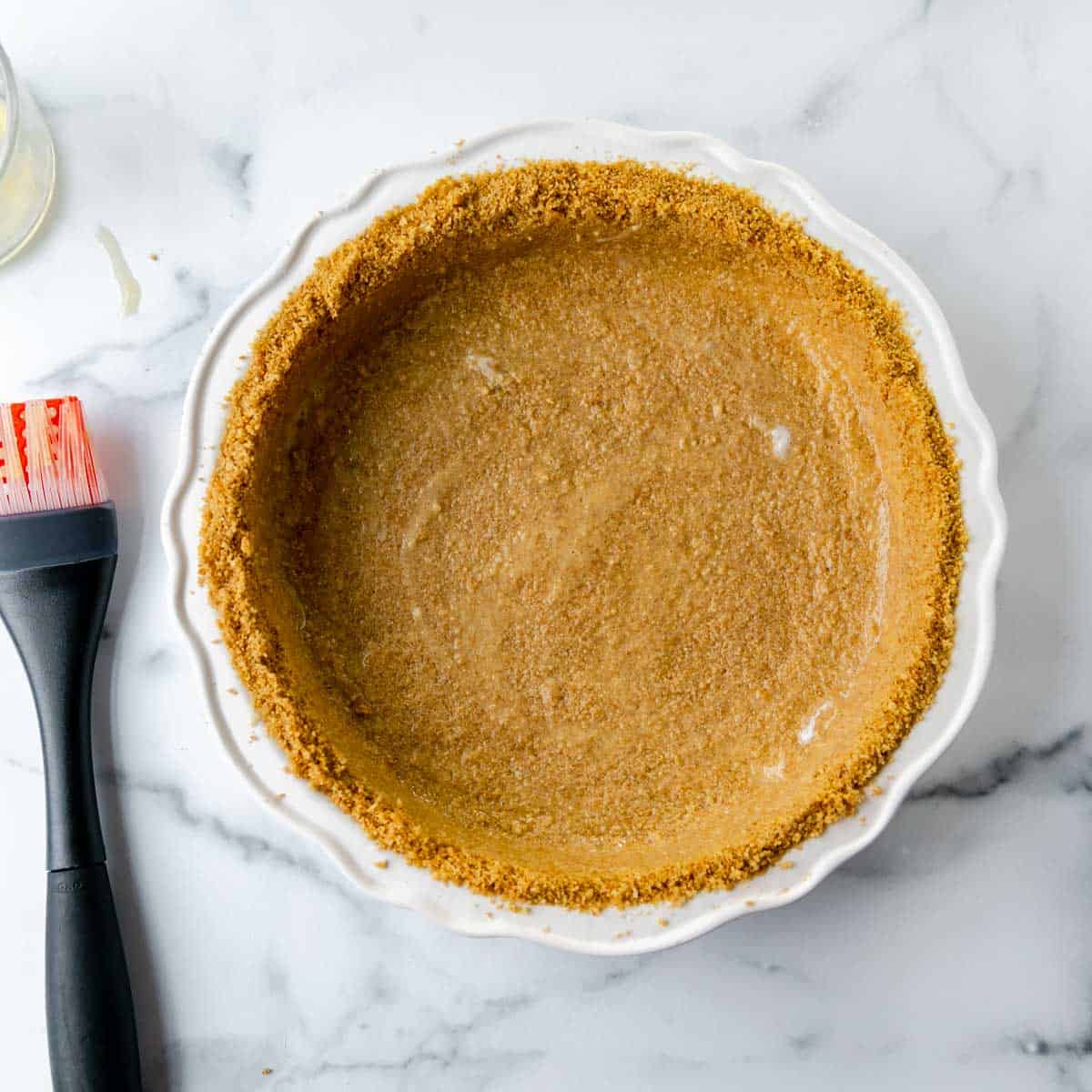 The graham cracker crust brushed with egg wash