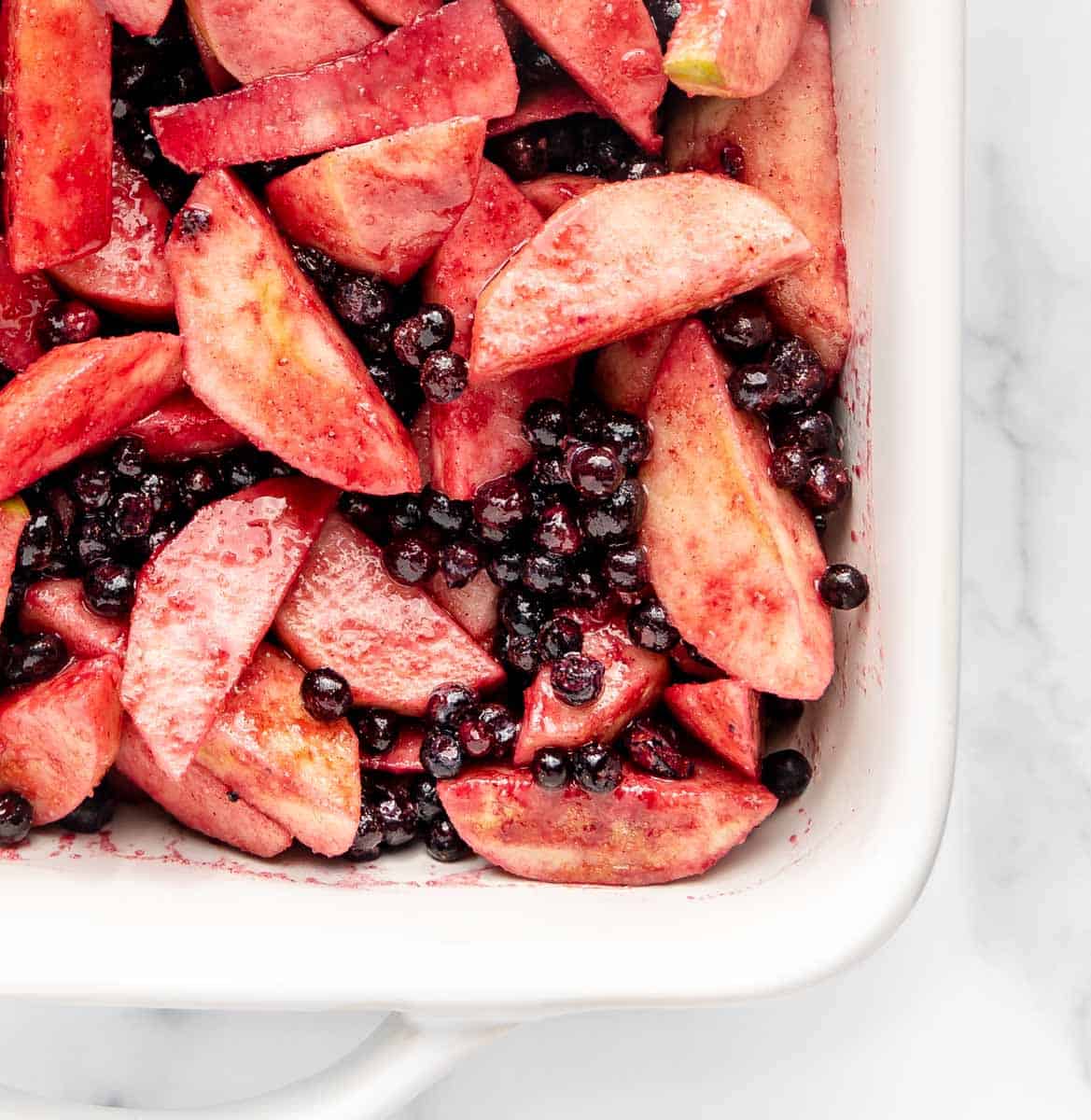Apples and blueberries in a baking dish