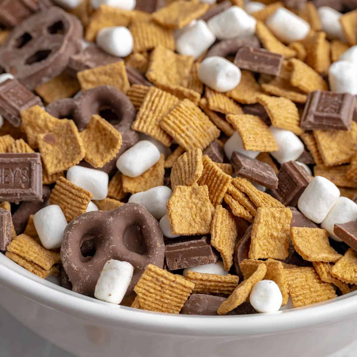 Up close photo of S'mores snack mix in a white bowl