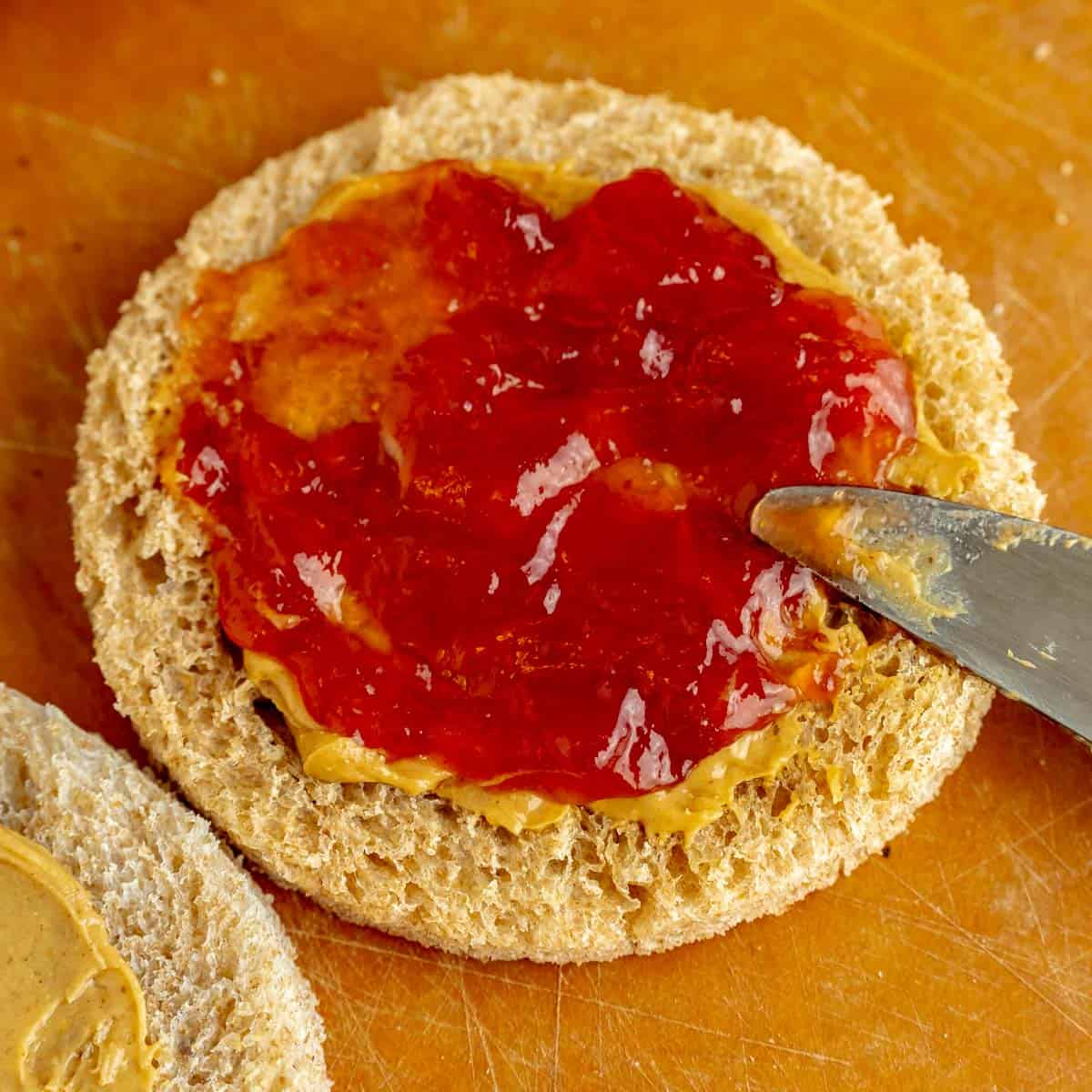 Jam spread with a butterknife onto a bread circle.