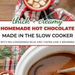 Two mugs of slow cooker hot chocolate topped with marshmallows rest on a plaid cloth, with text reading “thick + creamy HOMEMADE HOT CHOCOLATE MADE IN THE SLOW COOKER.”